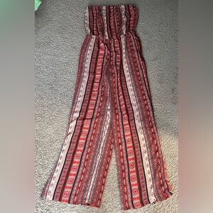 RUE 21 size LARGE Orange, cream, black & red patterned wide legged  romper